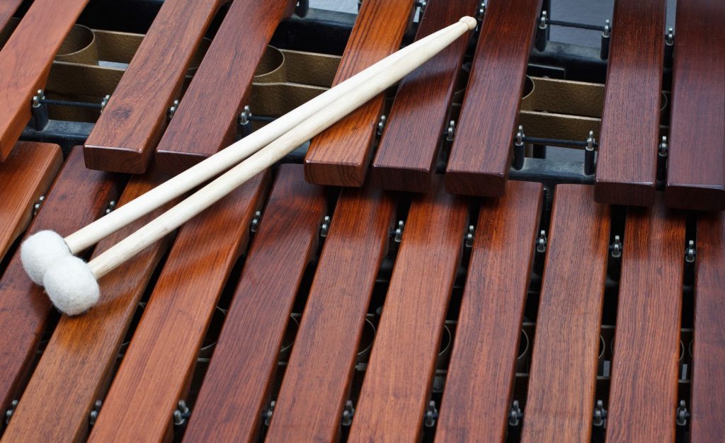 Close-up of a pair of mallets on a wooden marimba