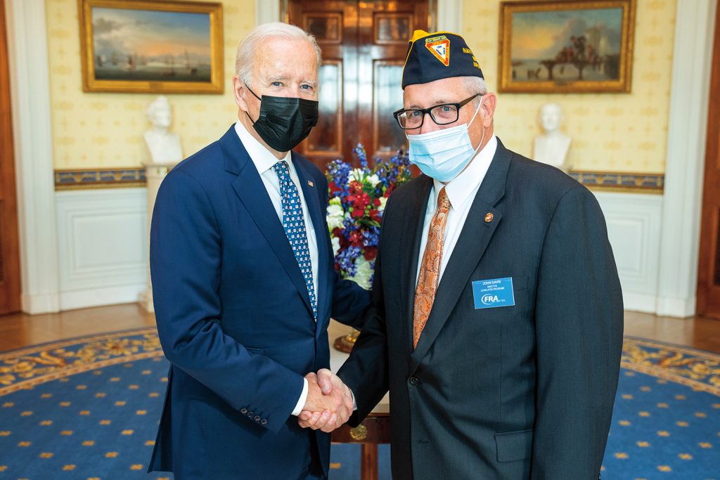 John Davis, right, shaking hands with President Joe Biden, left.