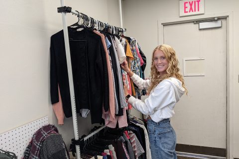 Student organizing clothes