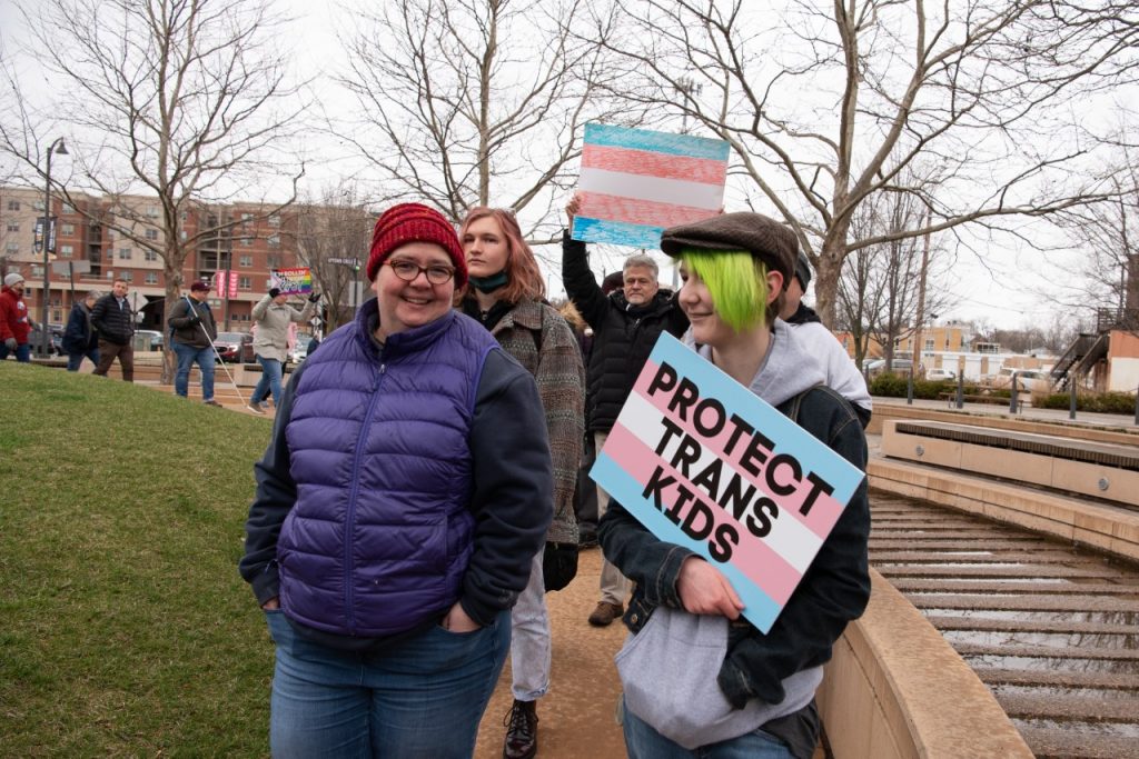 Person holding sign that says Protect Trans Kids