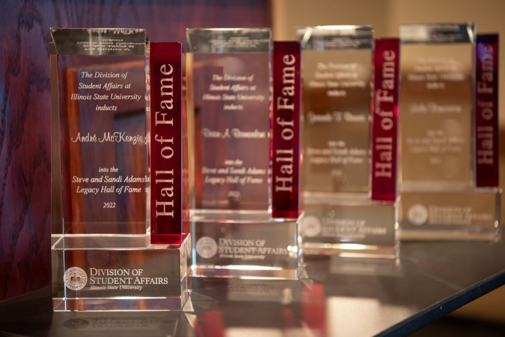 Four awards displayed on table