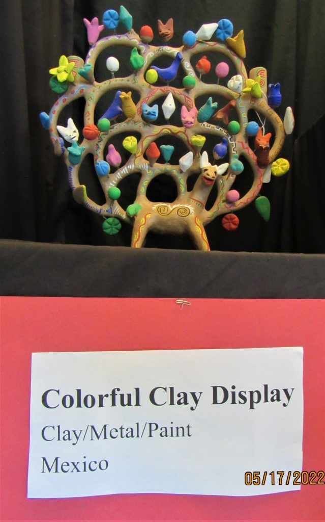 A colorful clay display of animal art from Mexico