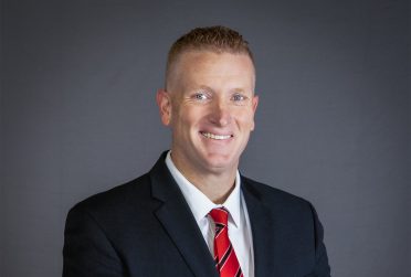 headshot of Director of Athletics Kyle Brennan