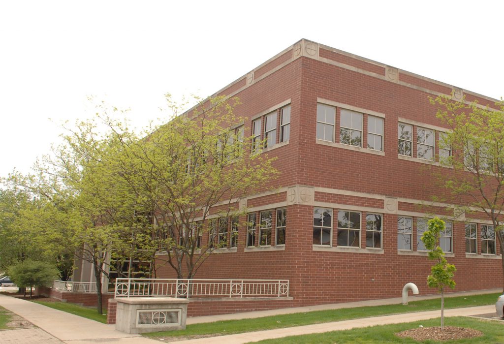 exterior of the Student Services Building in spring
