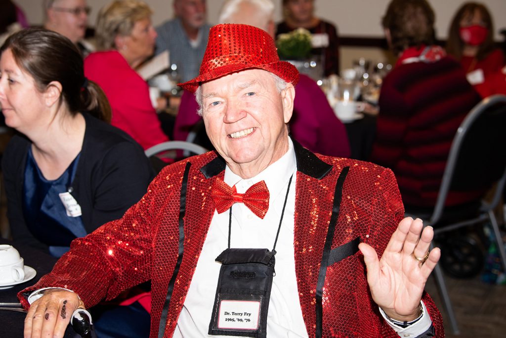 Dr. Terry Fry '65, M.S. '69, Ph.D. '76, shows great Redbird pride at the Half Century Club 2021 reunion dinner.