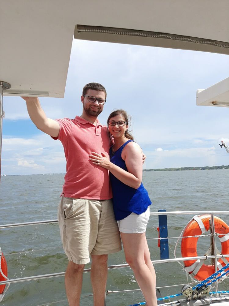 Logan and his fiancé Nicole are pictured on a boat.