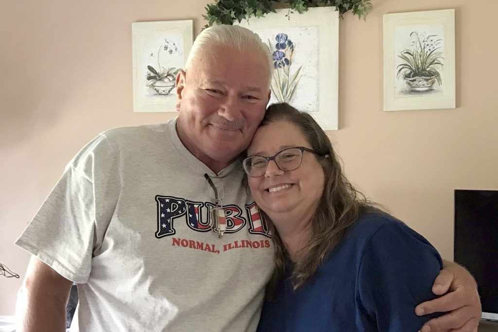 Mitch Pacyna, wearing a Pub II shirt, standing with his daughter, Michelle Schuline