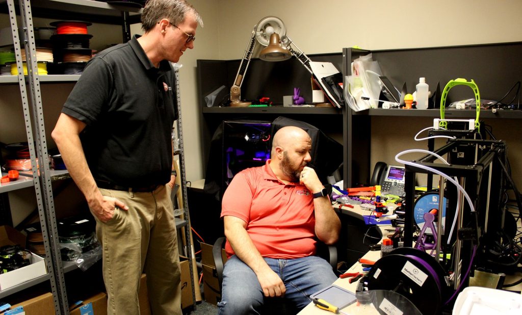 Paul Unsbee (left) and Steve Koehler oversee Milner Library's 3D printing services.