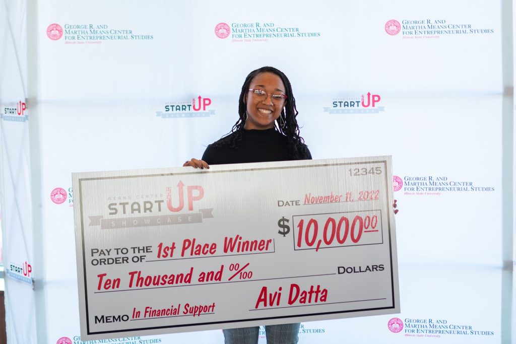 Joi Strickland poses with her $10,000 award.