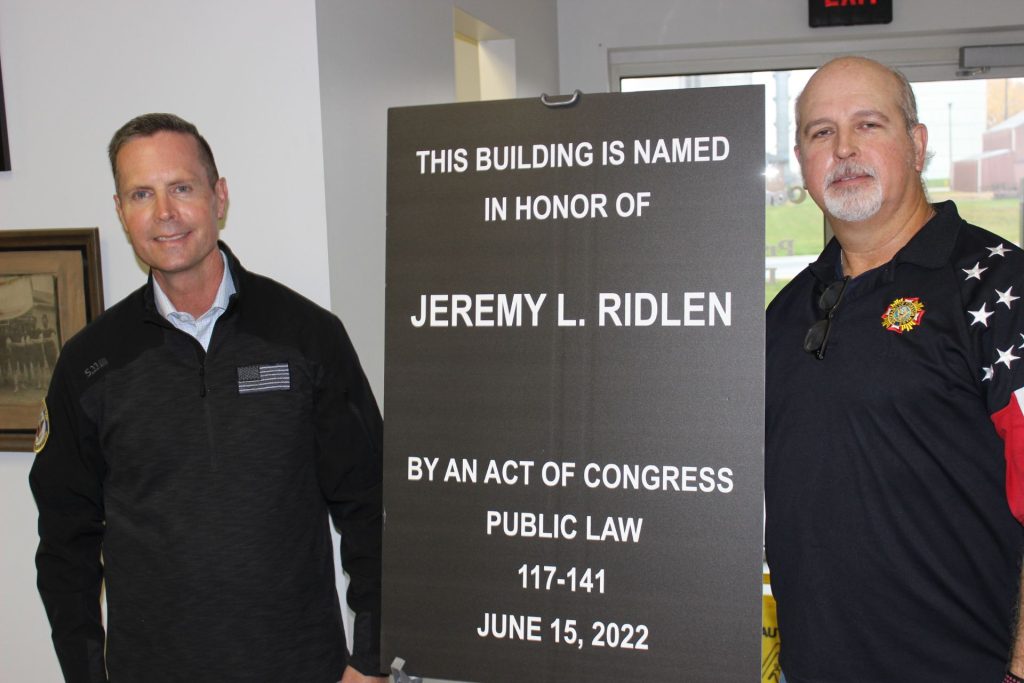 Rodney Davis and James Keith with plaque to honor Jeremy Ridlen