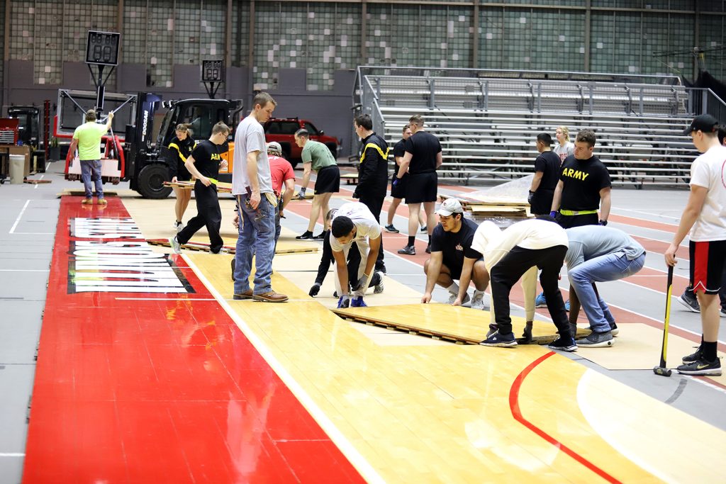 Members of Illinois State's Army ROTC assemble sections of Doug Collins Court at Horton Field House