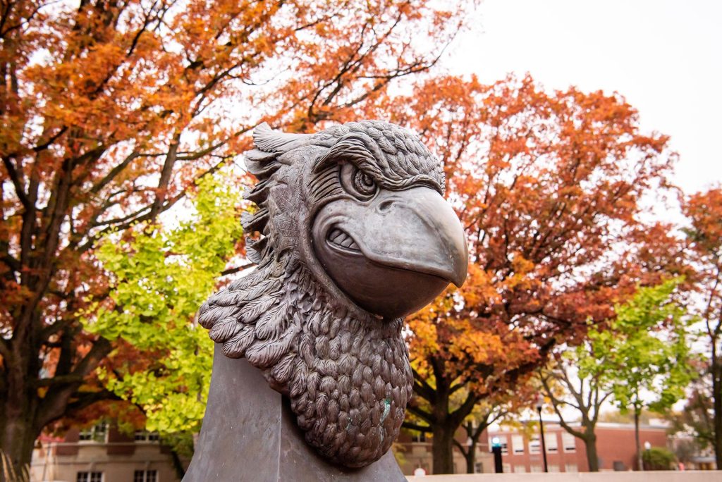 Redbird head statue in Redbird plaza at fall