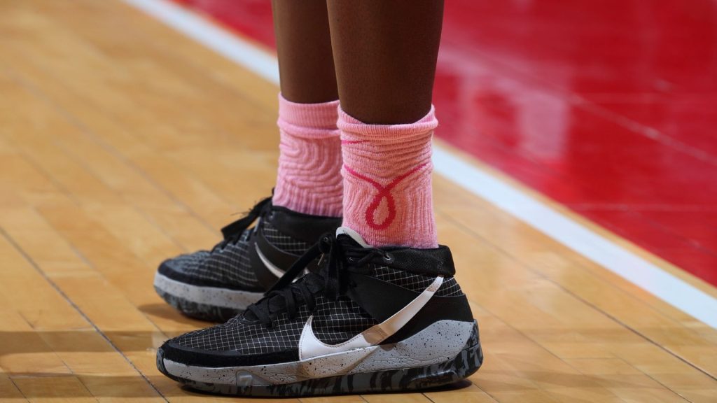 close-up of shoes and socks on a basketball court