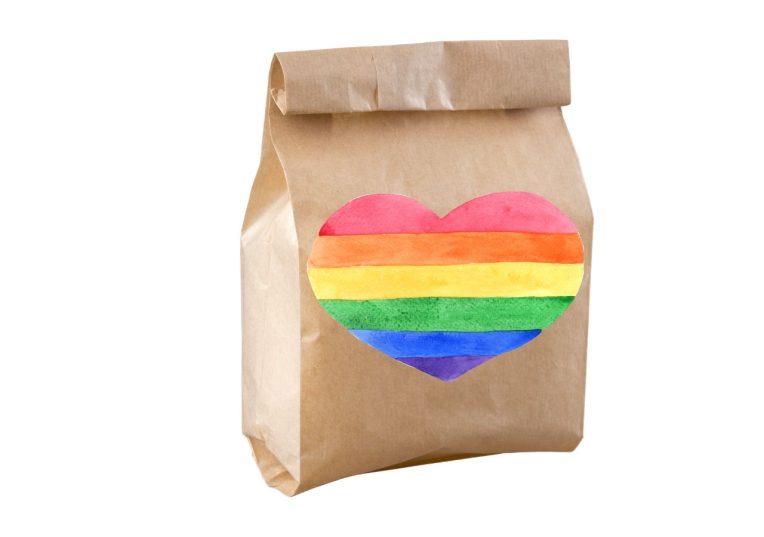 Brown lunch bag with a pride flag heart