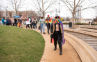 Queer Coalition Executive Board member Lawrence Lair leads the march at last year's Transgender Day of Visibility Sashay.