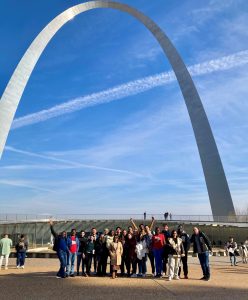 Group of people standing in front of arch