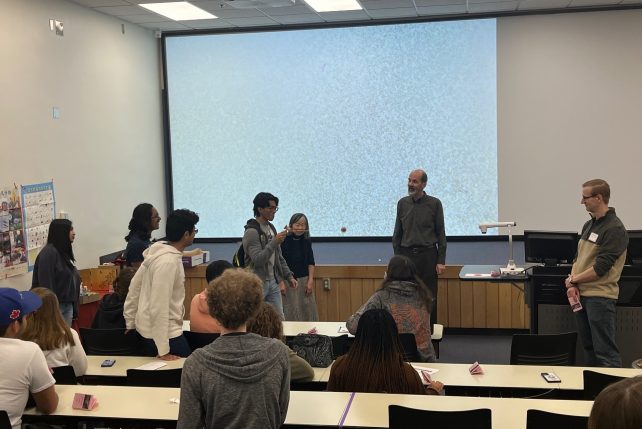 Japanese professors encourage students to try Japanese game.