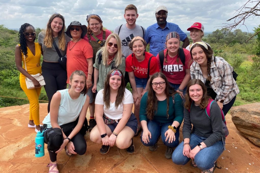 Professor Tom Buller poses with the students who participated in an Alternative Breaks program in Kenya in 2022. He's working on a project on how to increase diversity among Alternative Break participants.