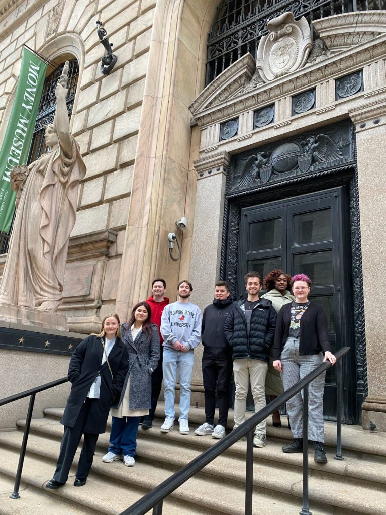 students on the steps of the The Money Museum 