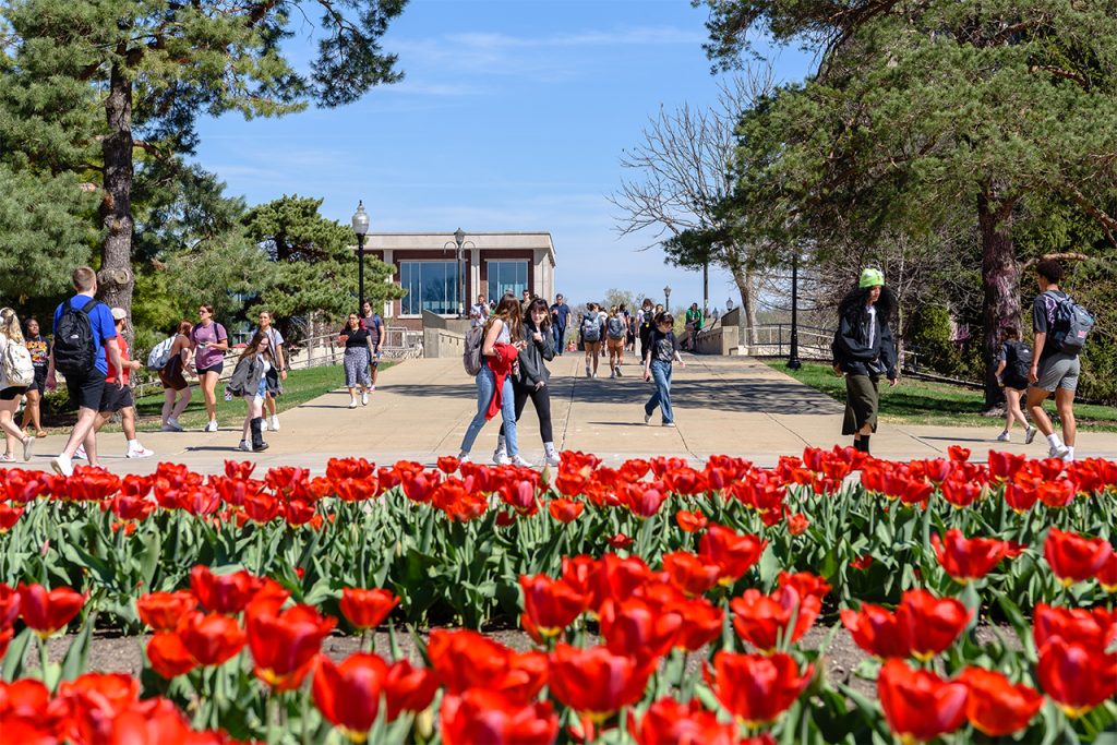 photo of campus with students walking by