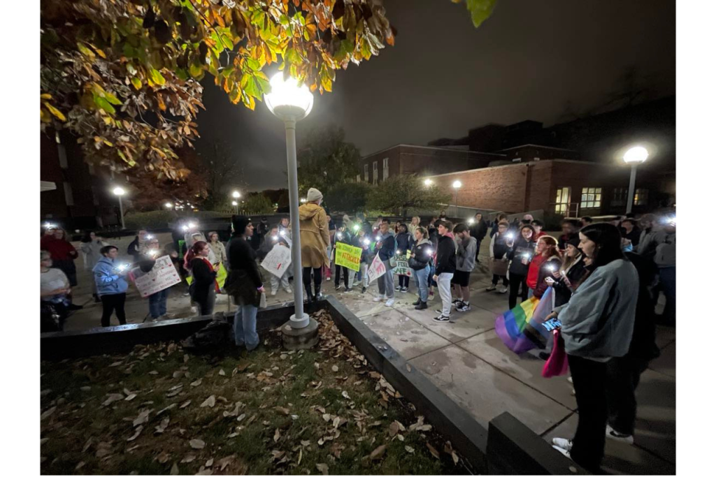 Hannah Pelphrey gives a speech to participants of the Take Back the Night March in front of the fountain by Stevenson Hall.