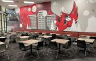 Wall mural in Watterson Dining Commons featuring Reggie the Redbird, resident halls, ISU seal, trees, a globe, and a basketball.