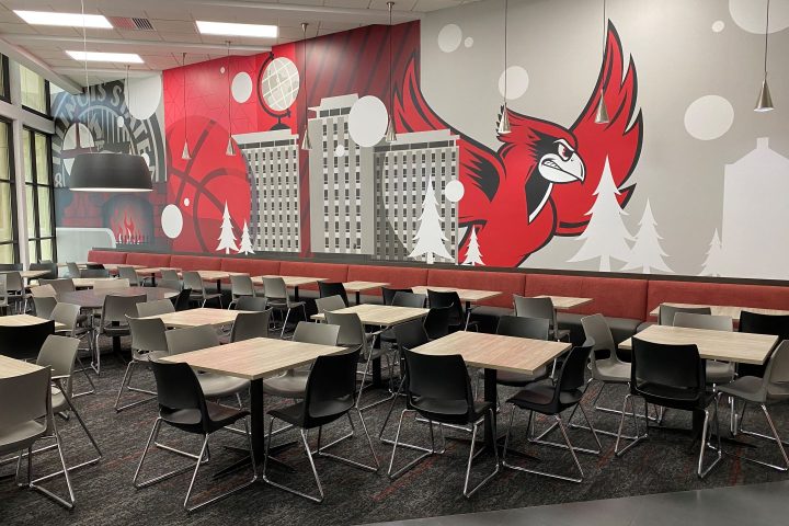 Wall mural in Watterson Dining Commons featuring Reggie the Redbird, resident halls, ISU seal, trees, a globe, and a basketball.