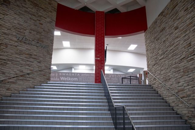 Entrance stairs to Watterson Dining Commons with red tiled pillar at top