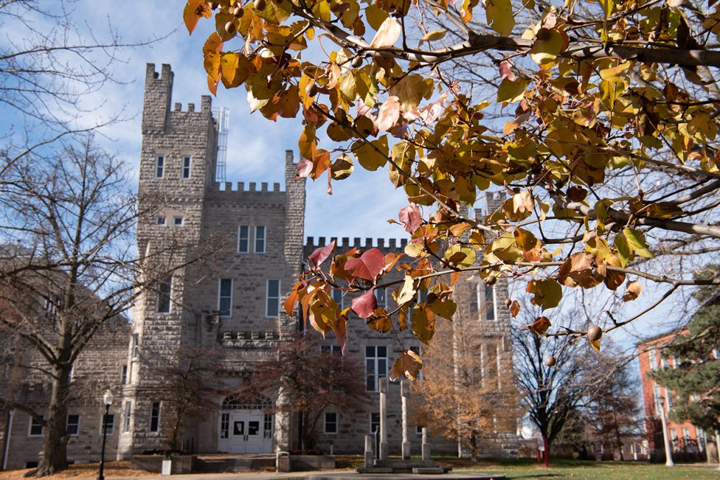 Cook Hall surrounded by fall foliage