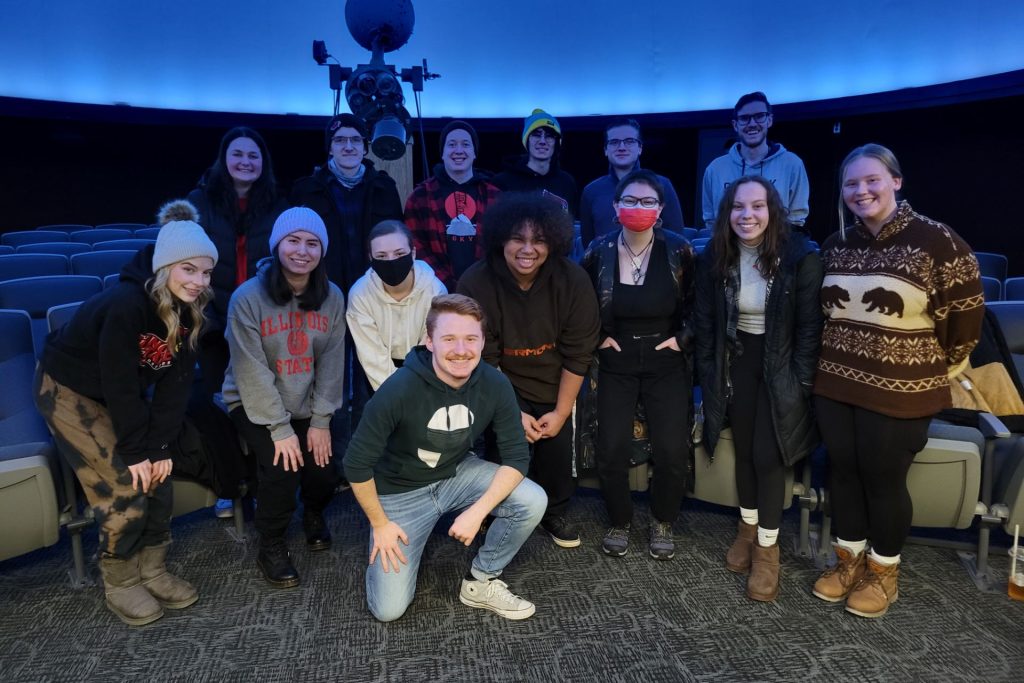 group of students posed in Planetarium