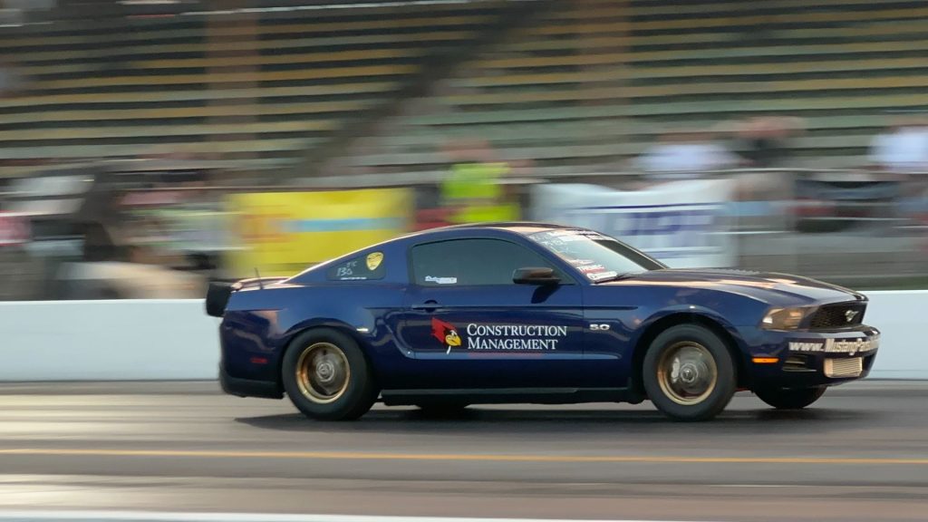 Mustang dragster in action with ISU logo on door