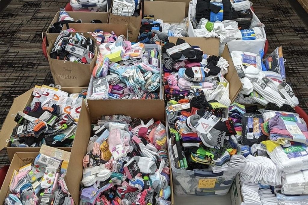 Boxes sorting different types and sizes of socks at the Center for Civic Engagement