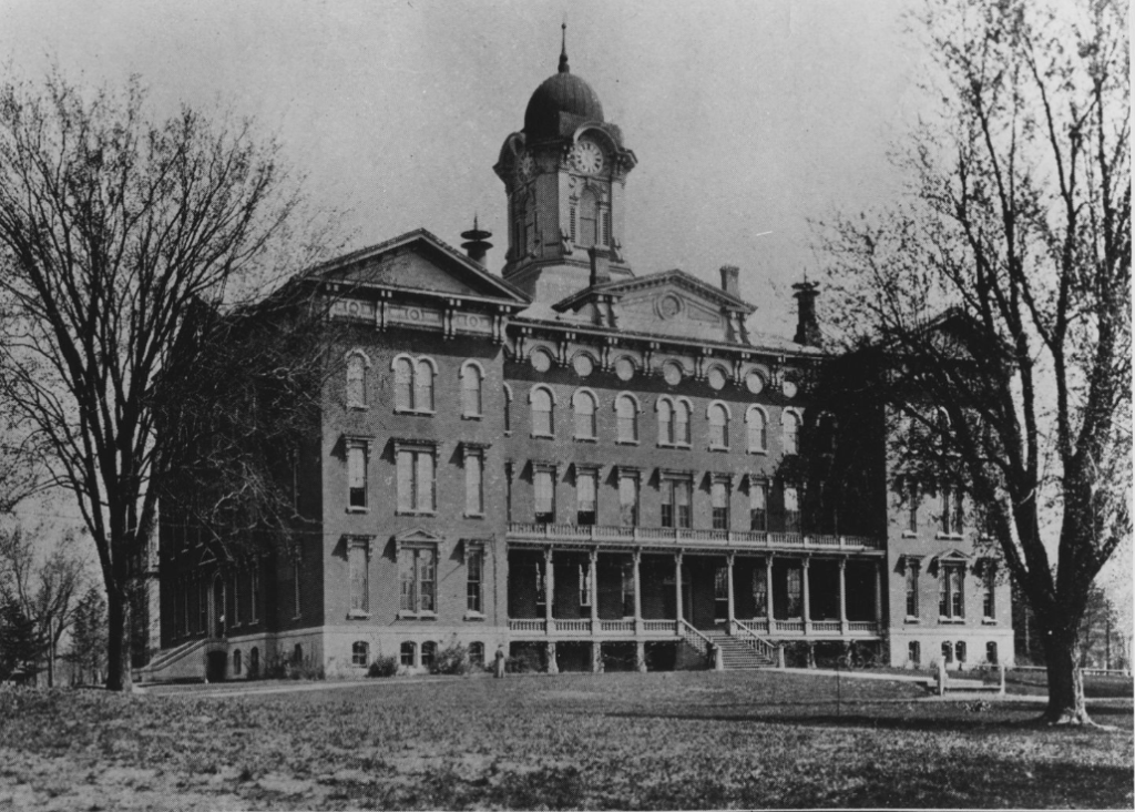 Exterior black and white photo of Old Main.