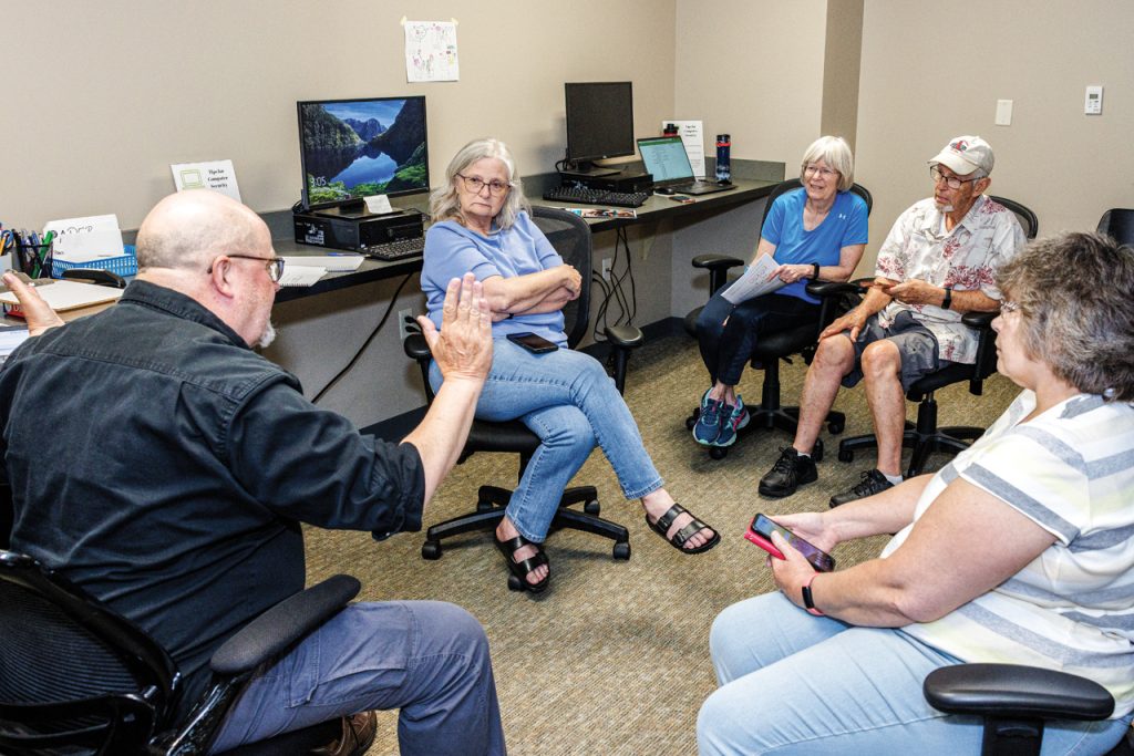 George Wiman, an instructional assistant professor in the College of Business, leads an Oasis Connections Technology Education class at the Activity and Recreation Center (ARC) in Normal. 
