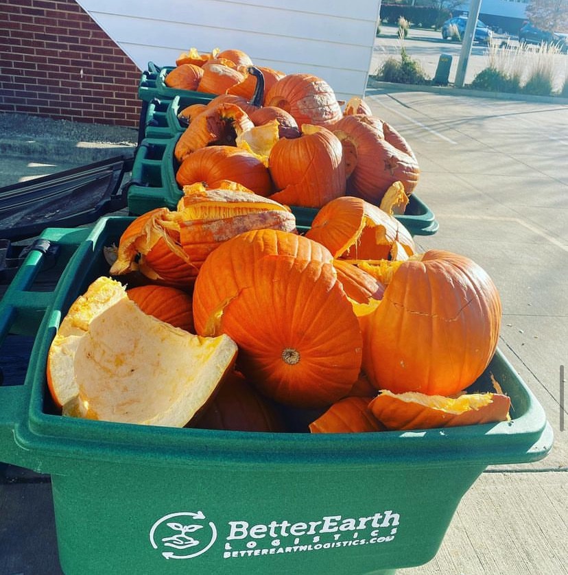 Five green pins of pumpkins in green compost bins labeled with Better Earth Logistics' logo