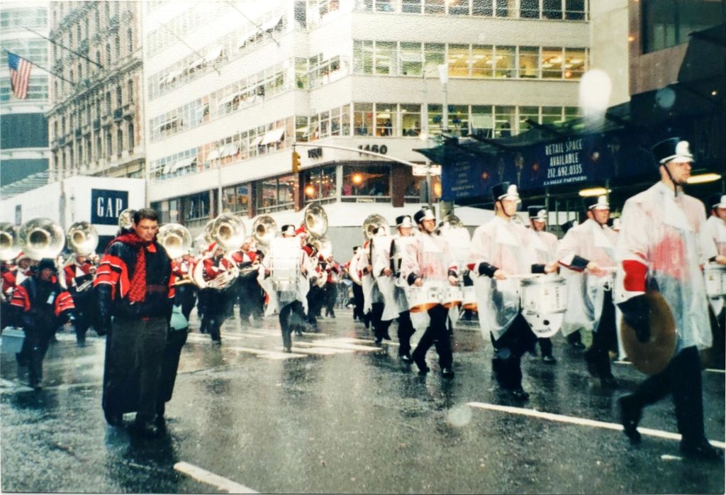 A marching band marches through New York City