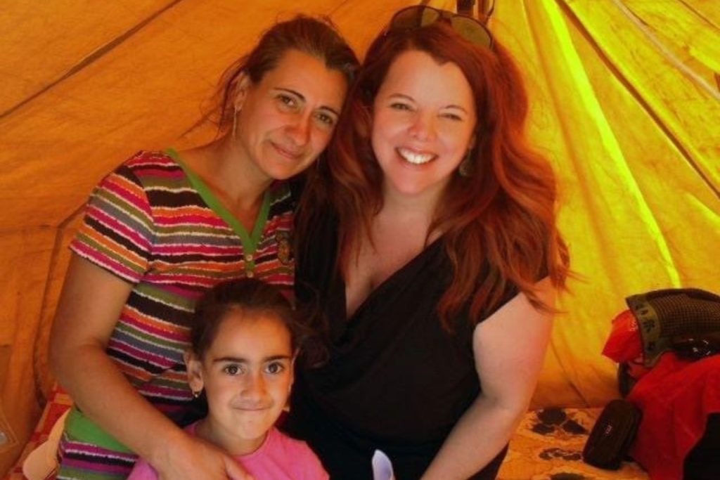 two women and child in tent
