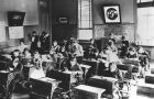 black and white photo of grade school students in a classroom
