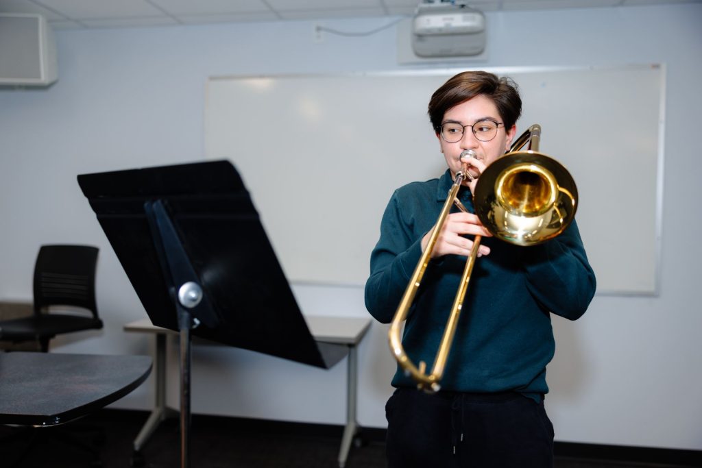 student playing trombone
