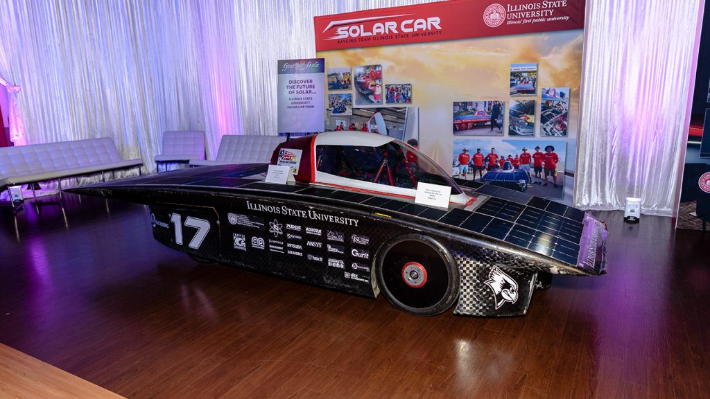 solar car parked inside a show room