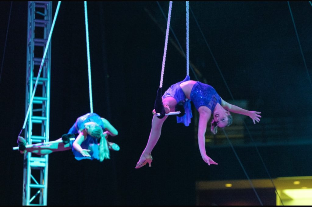Teagan Whittaker performing aerial dance trapeze.