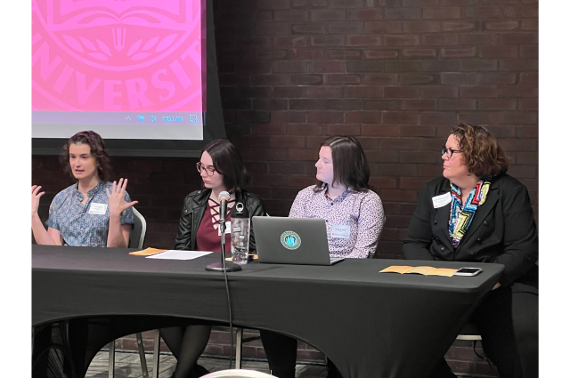 A panel of students (Xan Daggett, Kate Fortner, and Courtney Smith) with moderator Dr. Dawn Beichner-Thomas at the 26th annual WGSS Student Research Symposium.