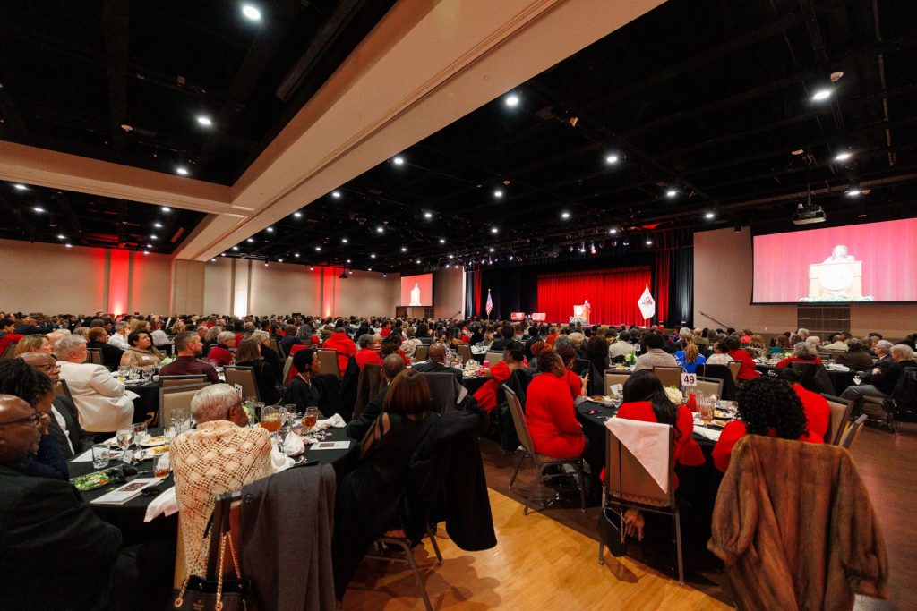 Wide-angle view of a capacity crowd in the Brown Ballroom