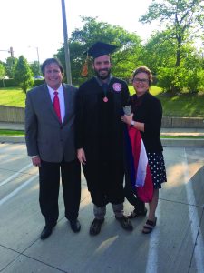 Mike Shier in ISU regalia and standing with his parents on graduation day