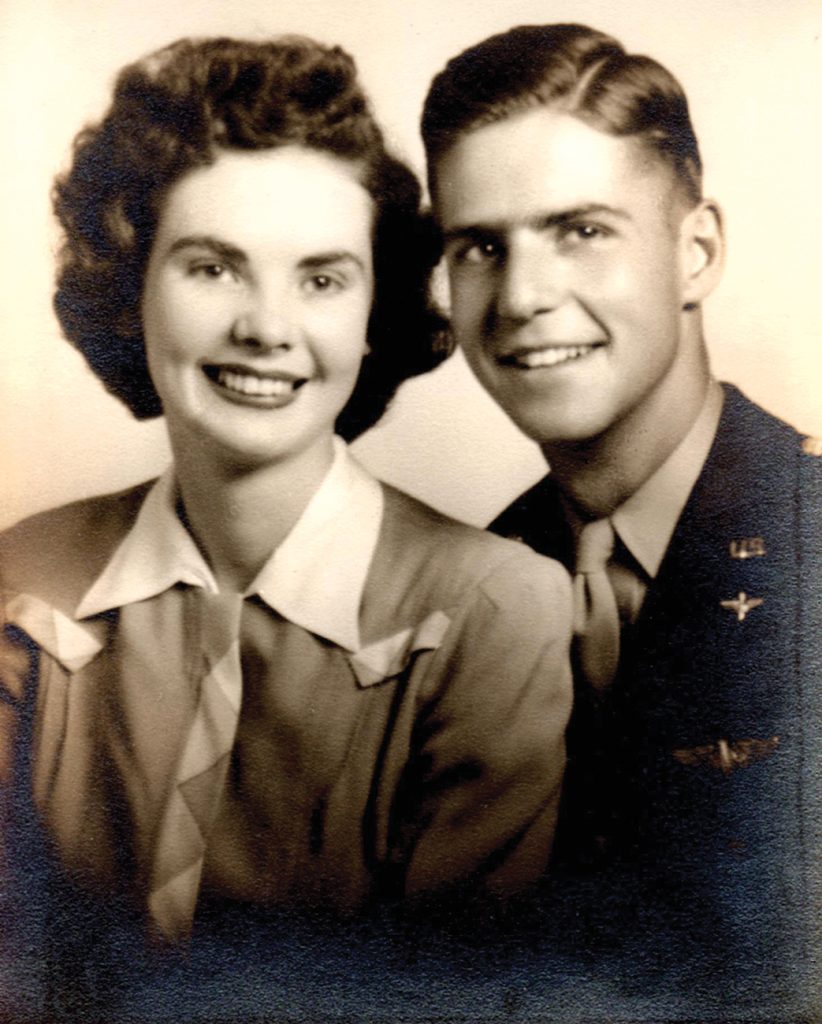 a black and white photo of a couple