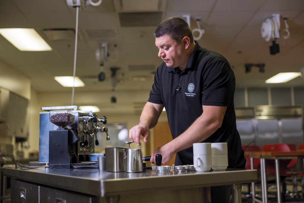 Dr. Erol Sozen, Ph.D., CHE demonstrates how to make the perfect latte.