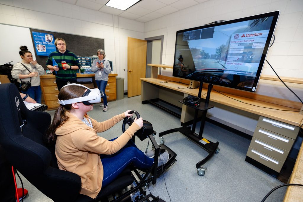 student using VR driving simulator