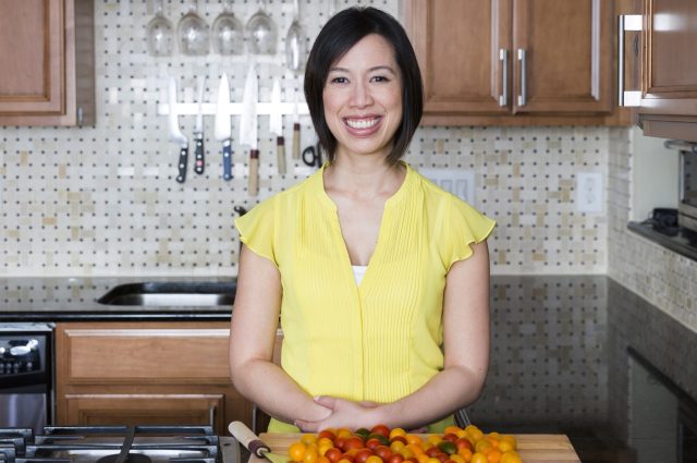 Photo of Christine Ha posing in a Kitchen space