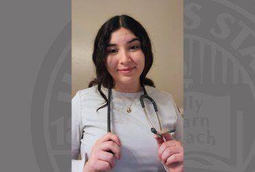 Samantha Charlton headshot while holding stethoscope around her neck. Gray ISU logo backgroun