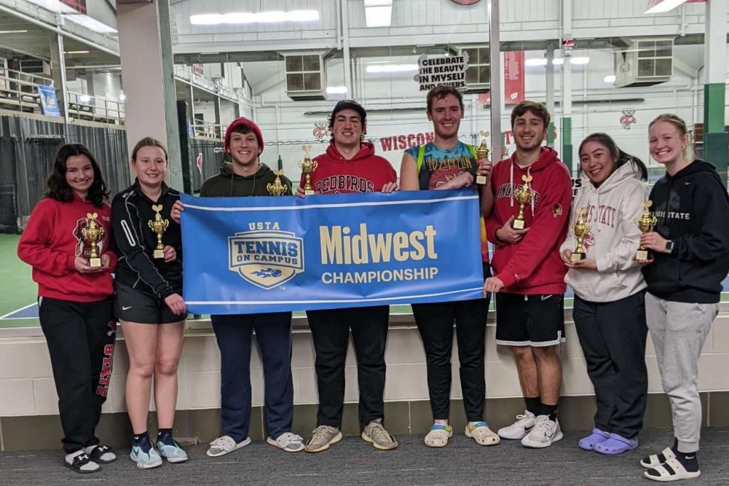 Group of students holding a sign that reads "Midwest Championship" "Tennis On Campus"